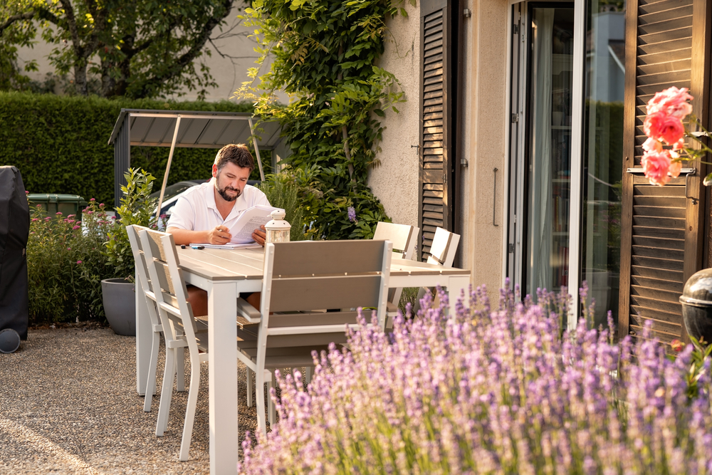 Adult,Man,Working,Or,Studying,Sitting,On,Terrace,In,Garden
