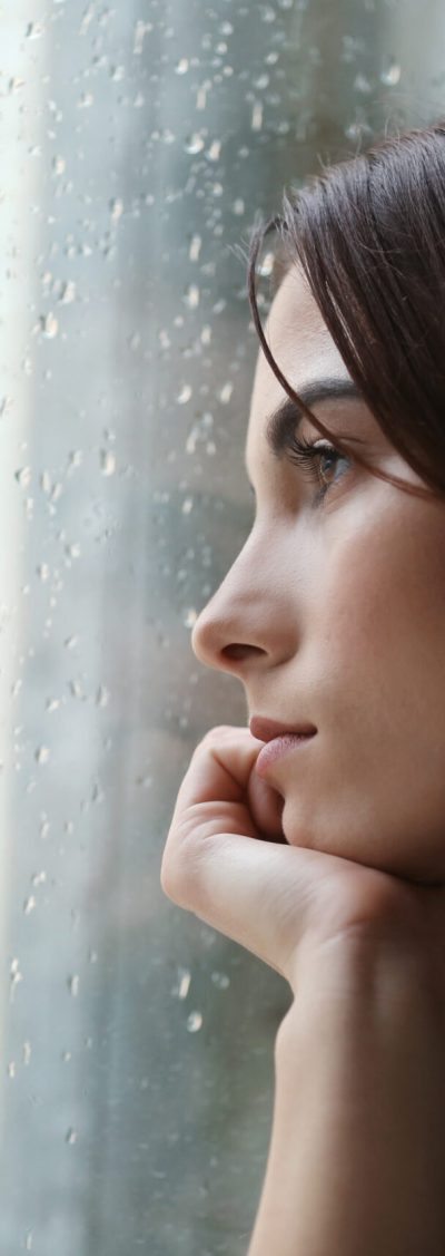 Depressed,Young,Woman,Near,Window,At,Home,,Closeup